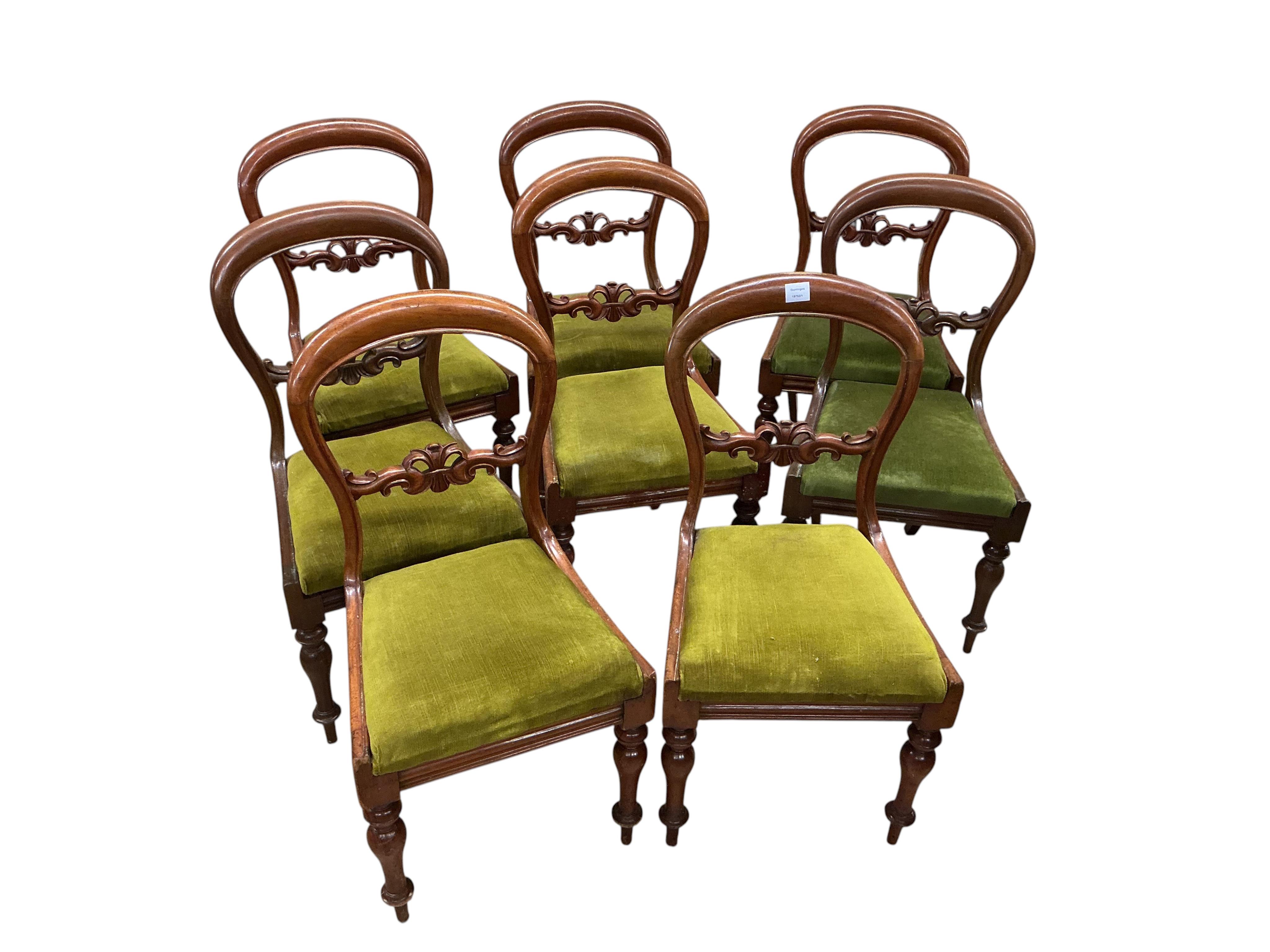A George III satinwood banded mahogany D end extending dining table, with two spare leaves, 284cm extended, depth 120cm, height 74cm, together with a set of eight Victorian mahogany balloon back dining chairs